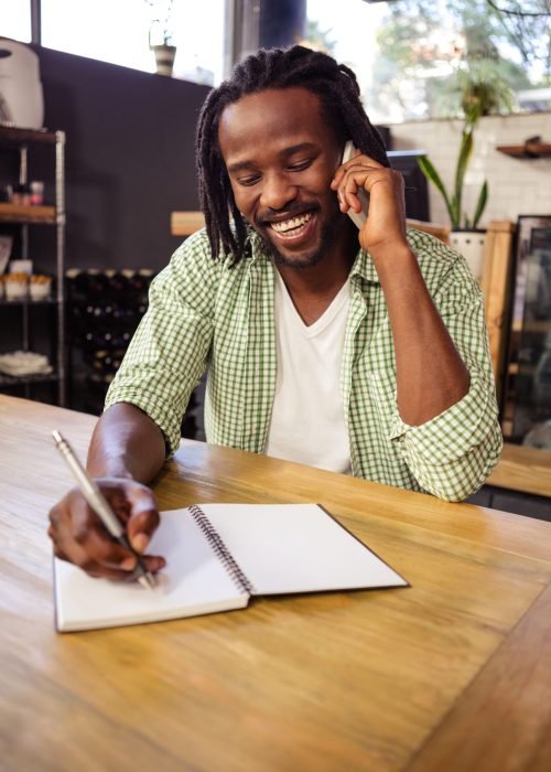 Man making a phone call in the cafe